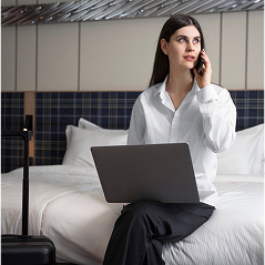 Woman working in hotel room